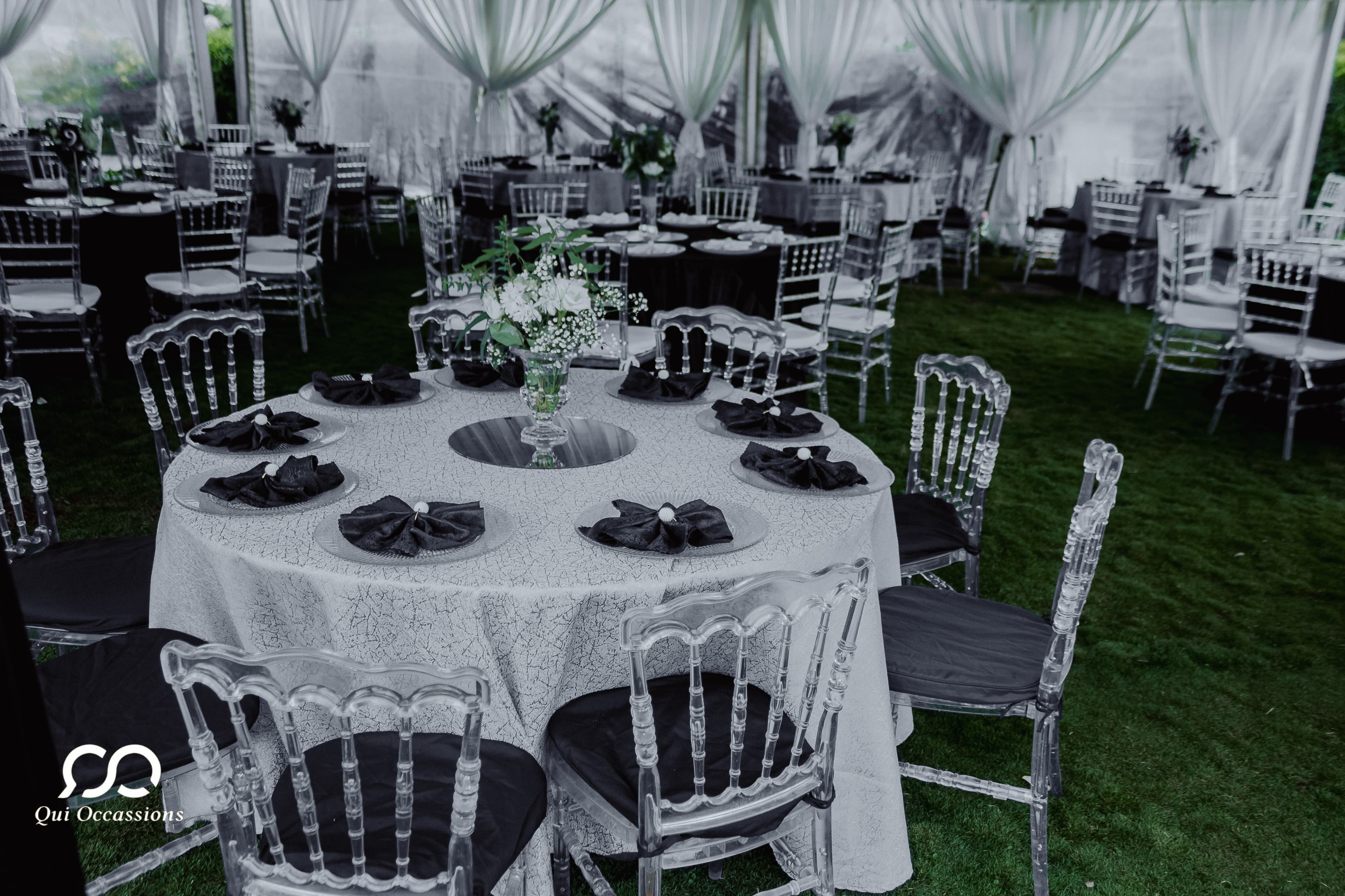 Beautiful white wedding chairs arranged for ceremony